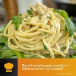 Těstoviny se smetanovou omáčkou na talíři s čerstvými bylinkami
