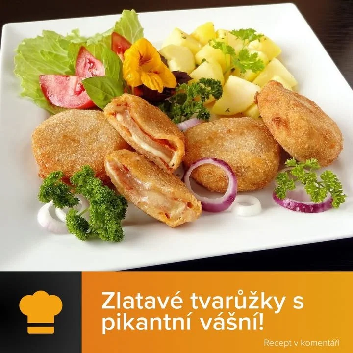 Zlatavé smažené tvarůžky obalené pikantním salámem na talíři